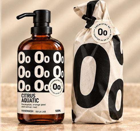 Off-white gift wrap printed with large black Oo shapes and a circular seal